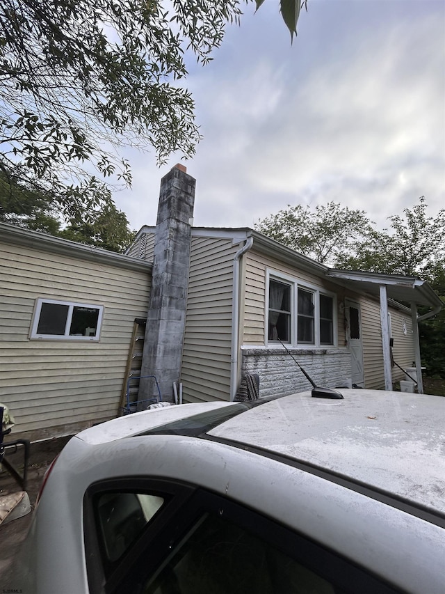 105 Lucille Dr, Egg Harbor Township, NJ 08234 - view of home's exterior with a chimney and stone siding