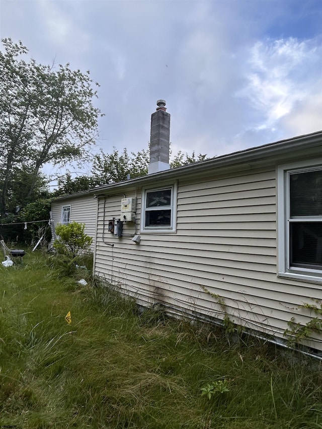 105 Lucille Dr, Egg Harbor Township, NJ 08234 - view of home's exterior with a chimney