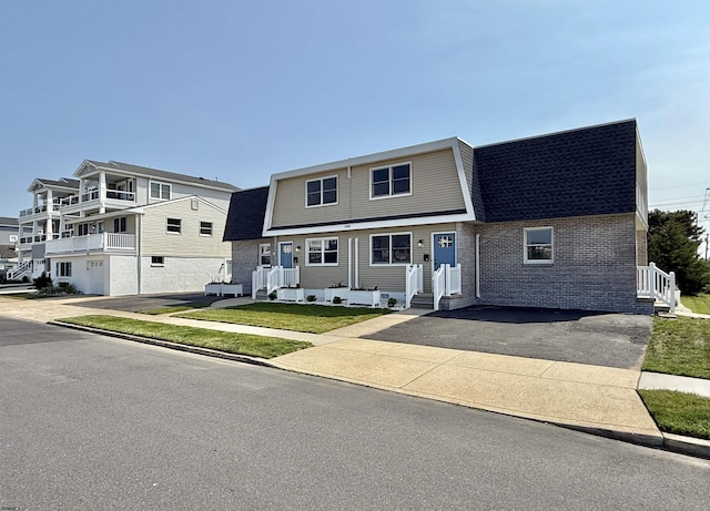 3400 W Brigantine Ave Unit 3, Brigantine, NJ 08203 - view of front of home featuring roof with shingles and brick siding