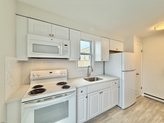 3400 W Brigantine Ave Unit 3, Brigantine, NJ 08203 - kitchen featuring white appliances, light countertops, light wood-style floors, and white cabinetry