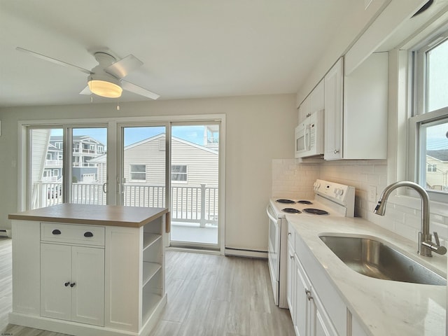 3400 W Brigantine Ave Unit 3, Brigantine, NJ 08203 - kitchen with white appliances, plenty of natural light, open shelves, and decorative backsplash