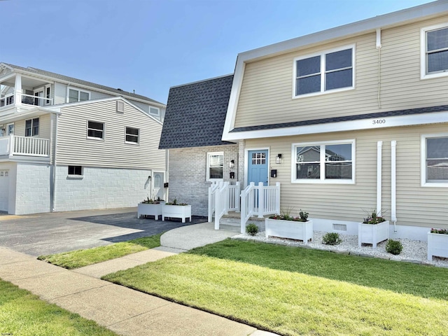 3400 W Brigantine Ave Unit 3, Brigantine, NJ 08203 - view of front of property with a front lawn and a shingled roof