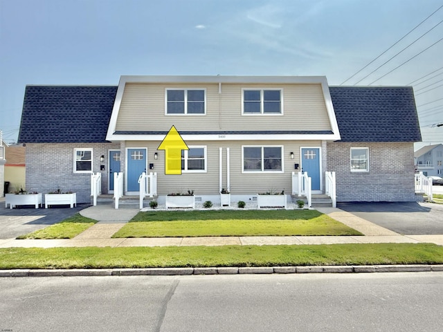 3400 W Brigantine Ave Unit 3, Brigantine, NJ 08203 - view of front of house with brick siding and a front yard