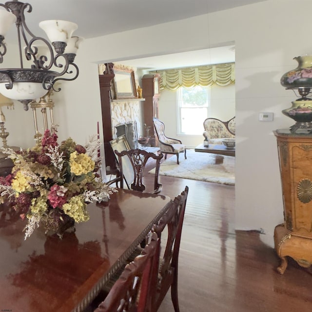 2453 Lahn Ln, Mays Landing, NJ 08330 - dining room featuring a chandelier, wood finished floors, and a fireplace