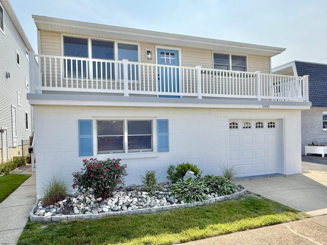 3400 W Brigantine Ave Unit 5, Brigantine, NJ 08203 - view of front of house featuring a balcony, a garage, and driveway