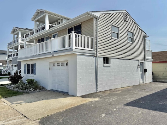 3400 W Brigantine Ave Unit 5, Brigantine, NJ 08203 - view of home's exterior with a garage, driveway, and a balcony