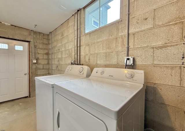 3400 W Brigantine Ave Unit 5, Brigantine, NJ 08203 - laundry area with independent washer and dryer, plenty of natural light, and concrete block wall