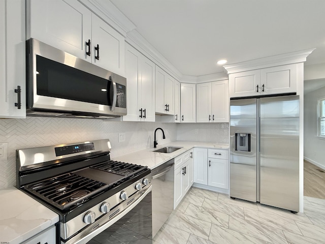 3400 W Brigantine Ave Unit 5, Brigantine, NJ 08203 - kitchen featuring stainless steel appliances, white cabinets, light stone counters, light marble finish flooring, and tasteful backsplash