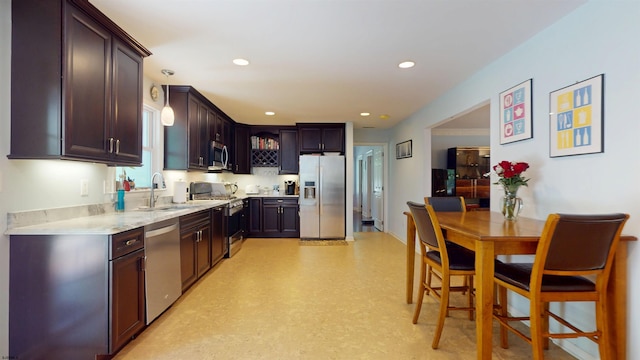 104 Locust Ave, Egg Harbor Township, NJ 08234 - kitchen with appliances with stainless steel finishes, dark brown cabinetry, recessed lighting, and pendant lighting