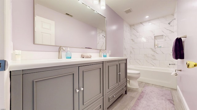 104 Locust Ave, Egg Harbor Township, NJ 08234 - bathroom with double vanity, bathtub / shower combination, wood finished floors, and recessed lighting