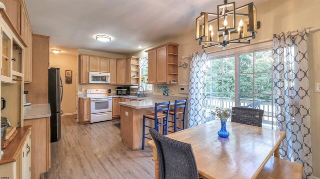 7 Ruth Ct, Absecon, NJ 08201 - dining room with a chandelier, light wood finished floors, and plenty of natural light