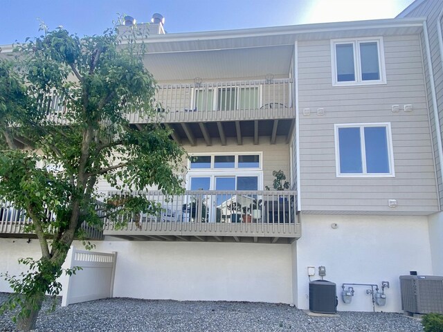 24 Coquille Beach Dr Unit 24, Brigantine, NJ 08203 - back of property with a balcony and stucco siding