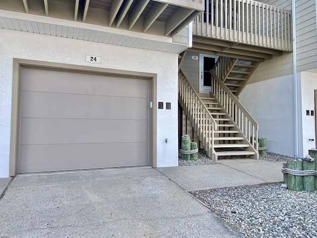 24 Coquille Beach Dr Unit 24, Brigantine, NJ 08203 - property entrance featuring concrete driveway, stucco siding, and a garage