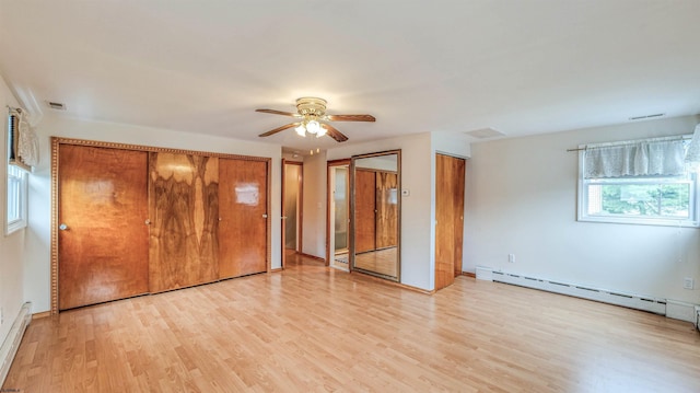 6015 Main St, Mays Landing, NJ 08330 - unfurnished bedroom featuring a baseboard radiator, light wood-style flooring, multiple closets, and a ceiling fan