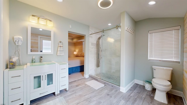 713 W Brigantine Ave, Brigantine, NJ 08203 - bathroom featuring vanity, a stall shower, wood finished floors, connected bathroom, and recessed lighting