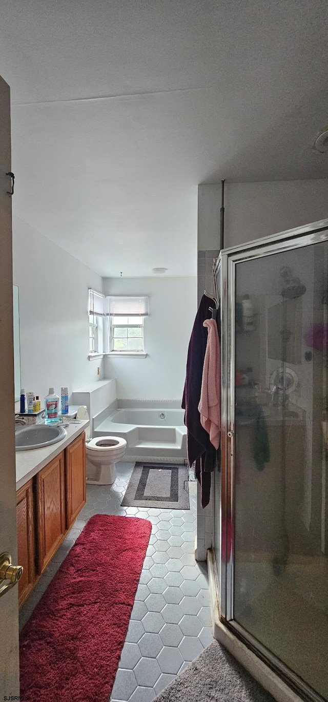 192 Exton Rd, Somers Point, NJ 08244 - full bath featuring vanity, a garden tub, a shower stall, and tile patterned flooring