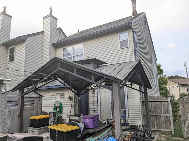 192 Exton Rd, Somers Point, NJ 08244 - back of property featuring a standing seam roof, a chimney, and a metal roof