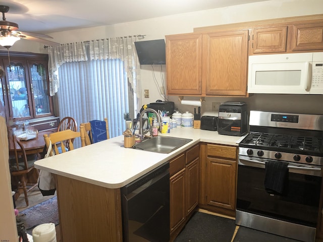 192 Exton Rd, Somers Point, NJ 08244 - kitchen featuring white microwave, stainless steel gas range oven, dishwashing machine, light countertops, and ceiling fan