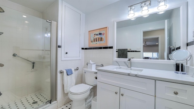 5000 Boardwalk Unit 107, Ventnor, NJ 08406 - bathroom with tile walls, a stall shower, vanity, and tile patterned flooring