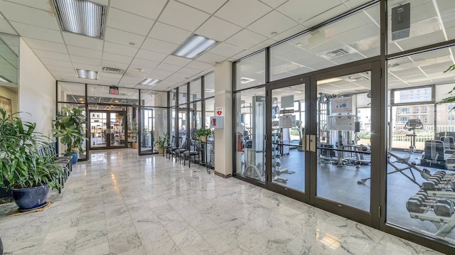 5000 Boardwalk Unit 107, Ventnor, NJ 08406 - building lobby with expansive windows and a drop ceiling
