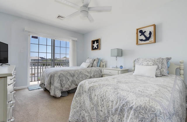 417 Albacore Ln, Brigantine, NJ 08203 - bedroom with light colored carpet, access to exterior, ceiling fan, and a water view