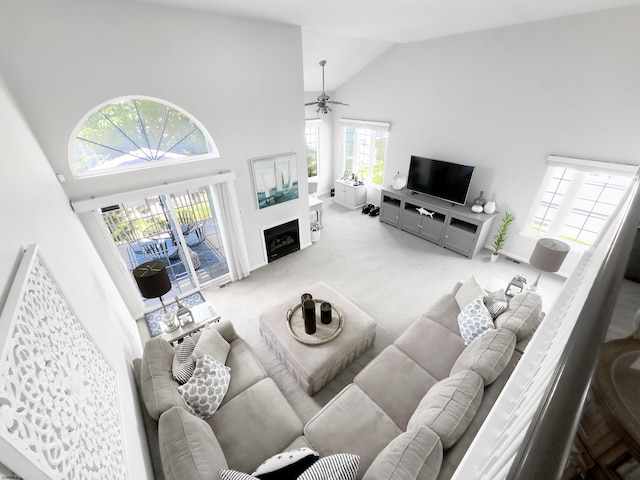 417 Albacore Ln, Brigantine, NJ 08203 - carpeted living room with high vaulted ceiling, a ceiling fan, and a fireplace