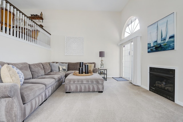 417 Albacore Ln, Brigantine, NJ 08203 - carpeted living area with a towering ceiling and a fireplace