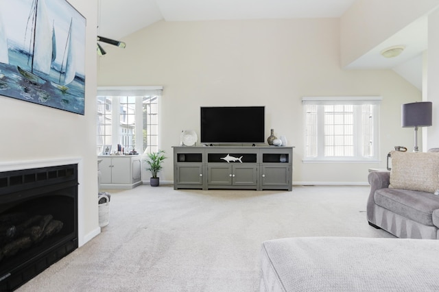 417 Albacore Ln, Brigantine, NJ 08203 - living area with vaulted ceiling, light colored carpet, and a fireplace