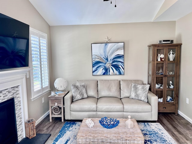 1304 Roberts Ave, Somers Point, NJ 08244 - living area with vaulted ceiling, wood finished floors, plenty of natural light, a fireplace, and a ceiling fan