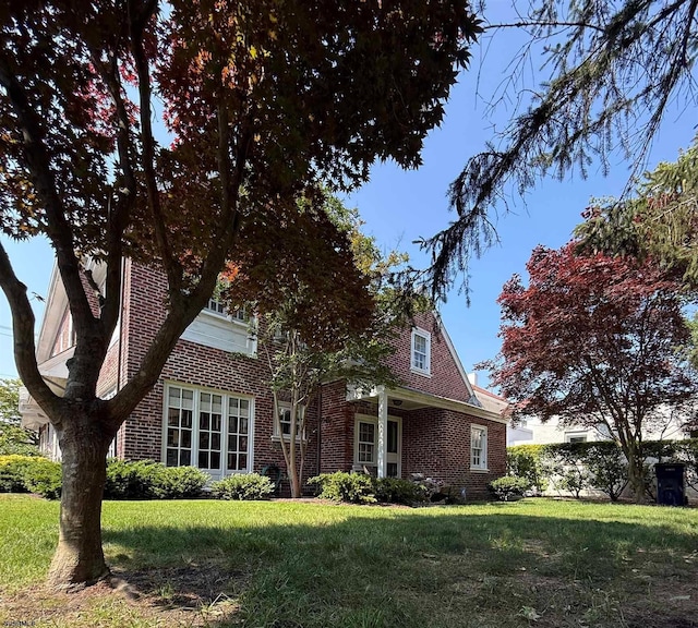 5904 Ventnor Ave, Ventnor, NJ 08406 - view of front of home with brick siding and a front lawn