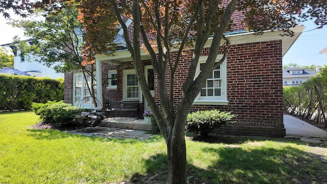 5904 Ventnor Ave, Ventnor, NJ 08406 - view of front of house featuring brick siding and a front lawn