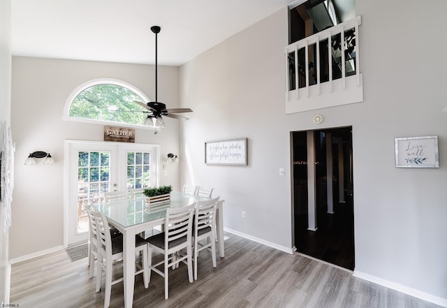 12 Fischer Rd, Linwood, NJ 08221 - dining room with french doors, wood finished floors, a ceiling fan, and a high ceiling