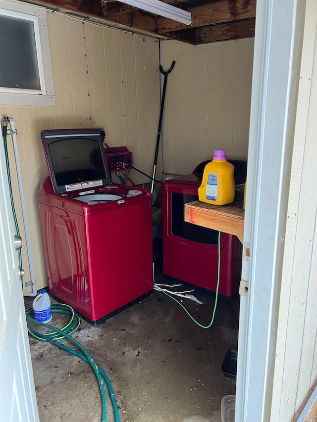 interior space featuring wooden walls and washer / dryer