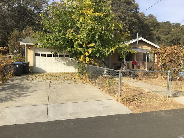 view of property hidden behind natural elements with a porch and a garage