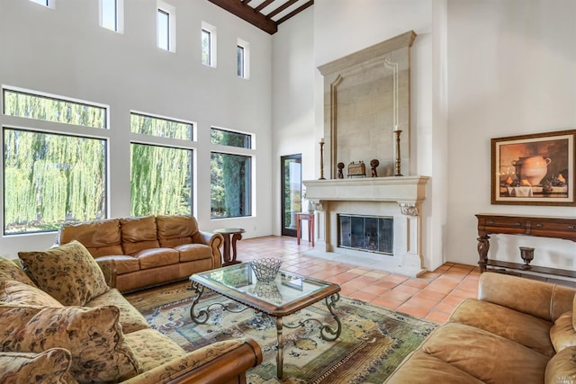 living room featuring light tile flooring, a healthy amount of sunlight, and a fireplace