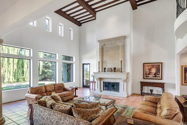 living room with light tile floors, a fireplace, high vaulted ceiling, and beamed ceiling