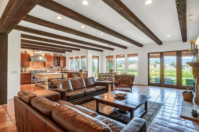 living room with a notable chandelier, french doors, light tile flooring, and beamed ceiling