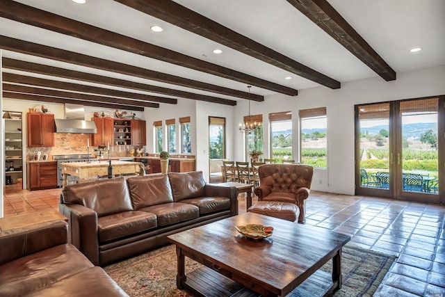 tiled living room featuring beam ceiling, a chandelier, and a healthy amount of sunlight