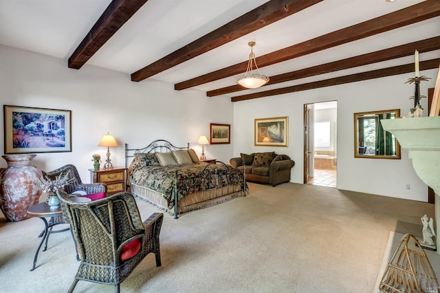 carpeted bedroom with beam ceiling and ensuite bathroom