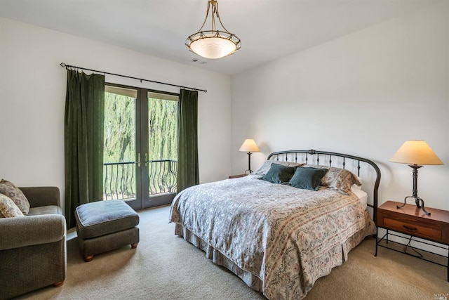 bedroom with french doors, light carpet, and access to exterior