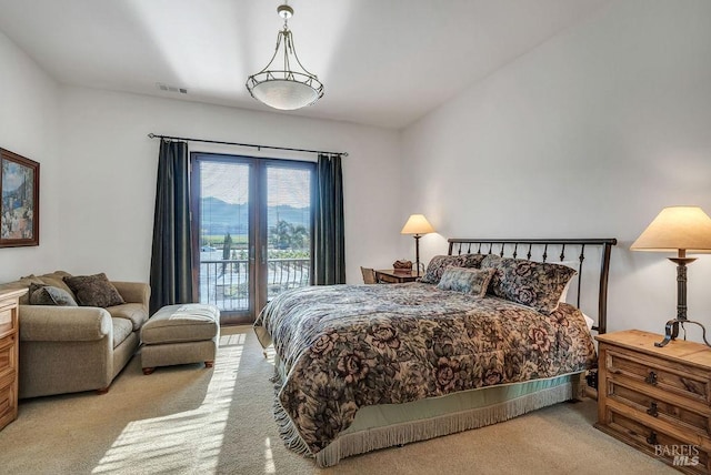 bedroom featuring light colored carpet