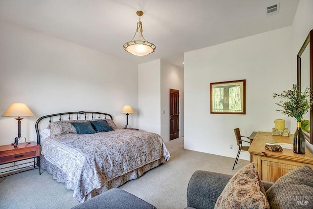 bedroom featuring light colored carpet