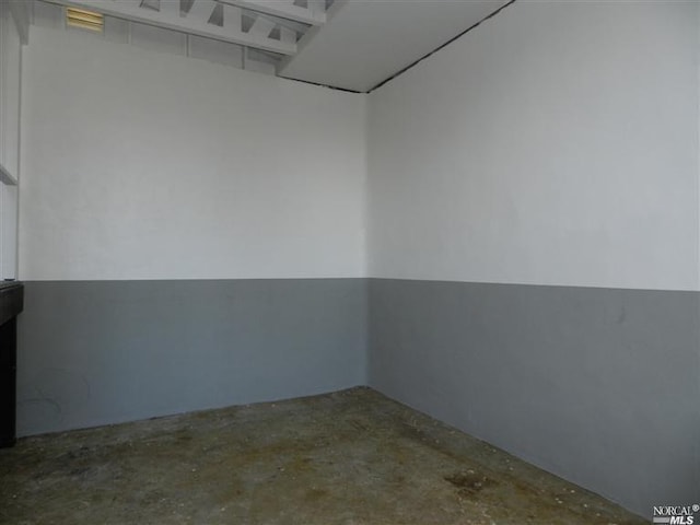 empty room with concrete flooring