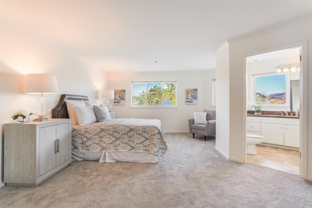 bedroom with light carpet, connected bathroom, ornamental molding, and sink