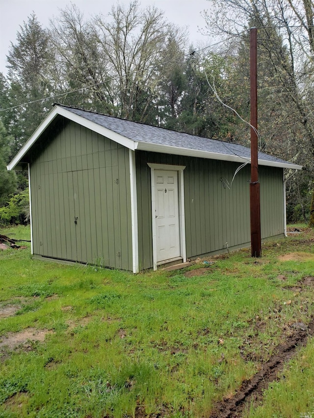 view of outdoor structure with a lawn