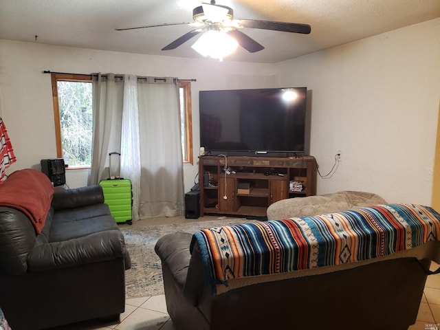 living room with ceiling fan and light tile floors