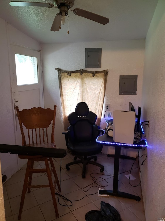 office space featuring ceiling fan and light tile floors