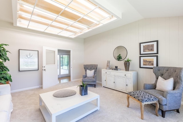 interior space with light carpet and vaulted ceiling