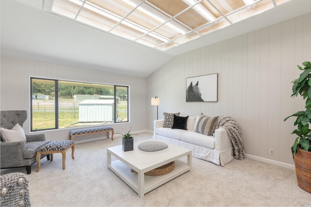 living room featuring light carpet, a healthy amount of sunlight, and lofted ceiling