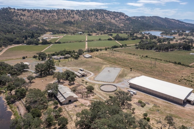 drone / aerial view featuring a rural view and a mountain view